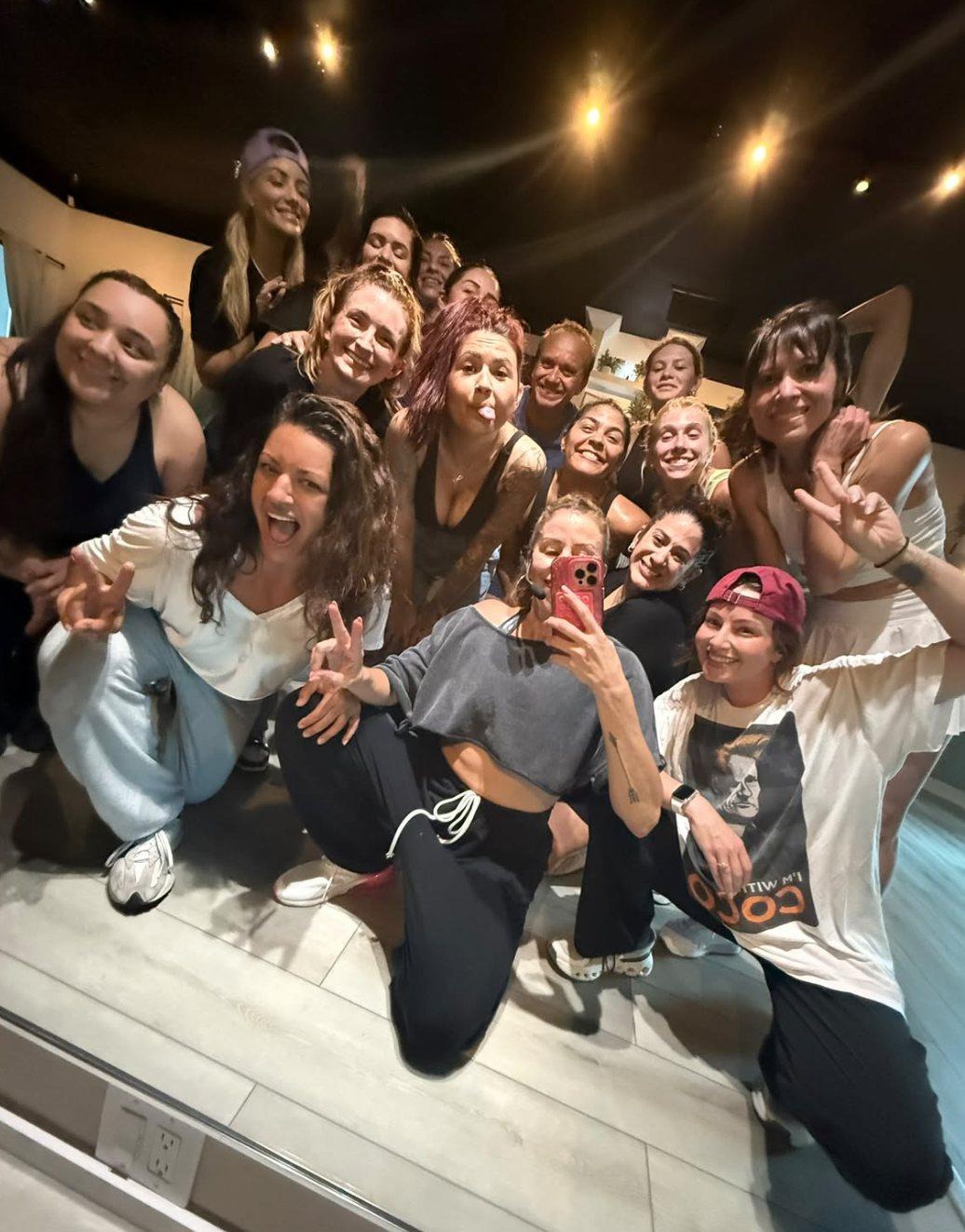 Clients and instructors celebrating together after a class at The Sweat Shoppe by Randi in North Palm Beach, Florida