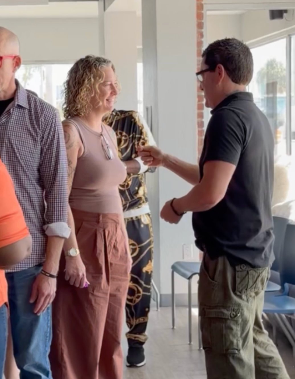 Coworkers laughing and connecting naturally during a team workshop